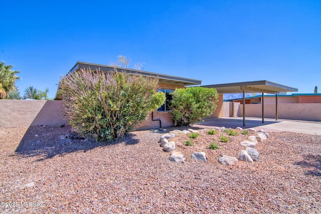view of front of home with fence