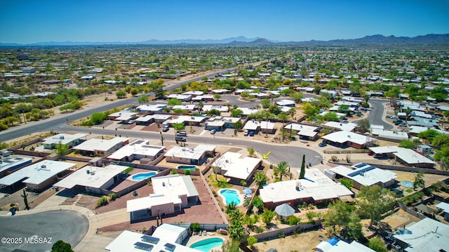 birds eye view of property with a mountain view and a residential view