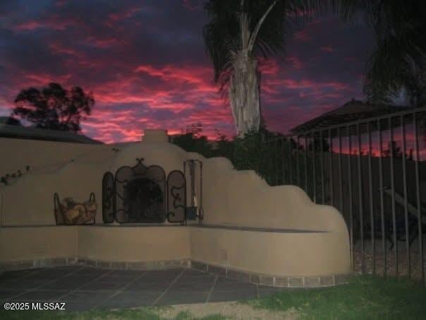 view of patio terrace at dusk
