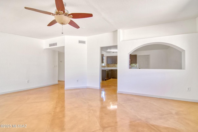 spare room featuring visible vents, ceiling fan, and light tile patterned flooring