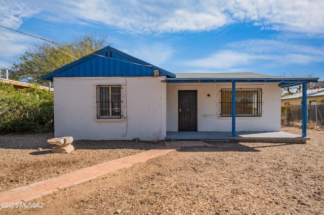 view of front facade with concrete block siding