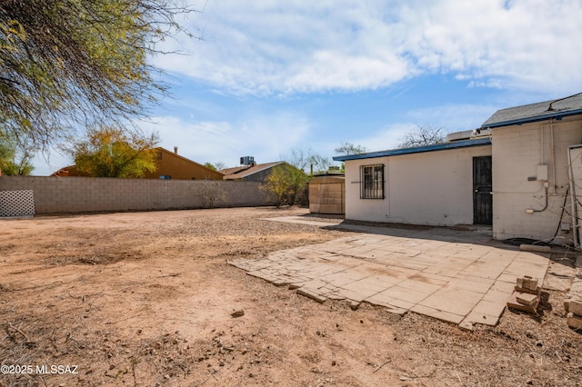 view of yard with fence and a patio area