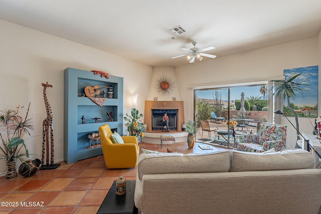 3437 S Abrego Dr, Green Valley, AZ 85614 - living room featuring tile patterned floors, visible vents, and a ceiling fan