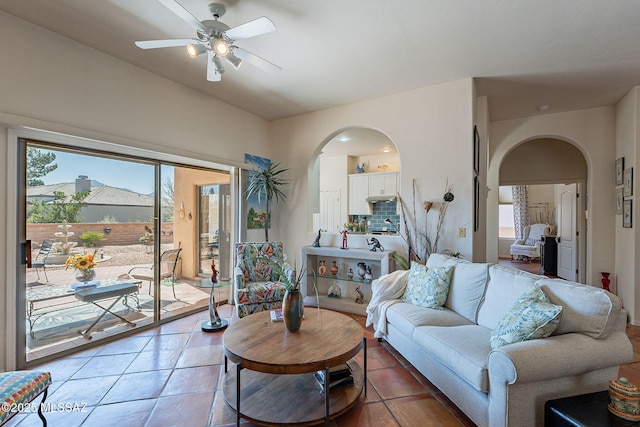 3437 S Abrego Dr, Green Valley, AZ 85614 - living area featuring arched walkways, ceiling fan, and light tile patterned floors
