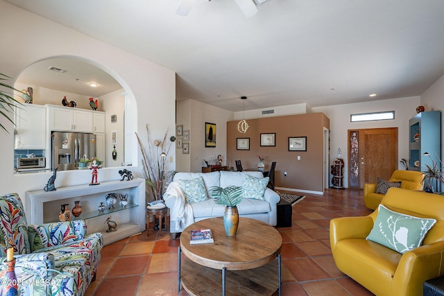 3437 S Abrego Dr, Green Valley, AZ 85614 - living area featuring visible vents, a toaster, tile patterned floors, a ceiling fan, and arched walkways