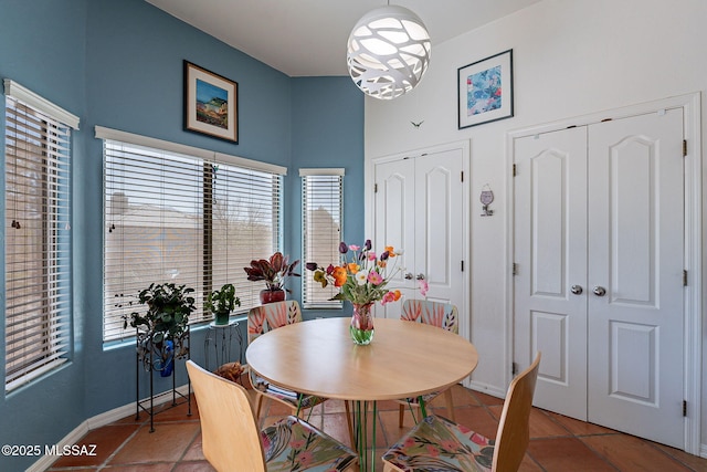 3437 S Abrego Dr, Green Valley, AZ 85614 - tiled dining room featuring baseboards and an inviting chandelier