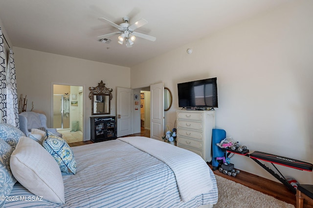 3437 S Abrego Dr, Green Valley, AZ 85614 - bedroom with wood finished floors, ensuite bath, baseboards, visible vents, and ceiling fan