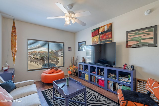 3437 S Abrego Dr, Green Valley, AZ 85614 - living area with baseboards, wood finished floors, and a ceiling fan