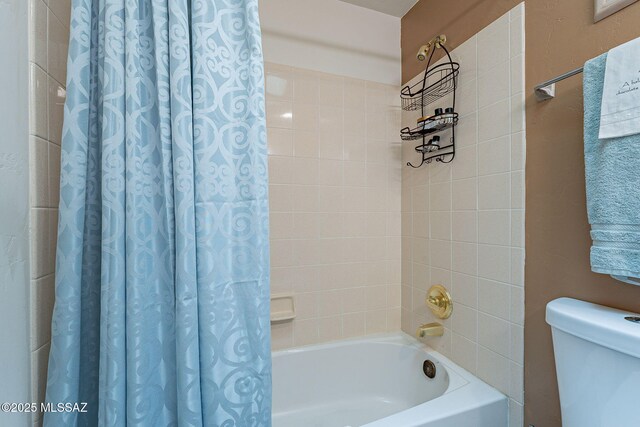 3437 S Abrego Dr, Green Valley, AZ 85614 - bathroom featuring toilet and shower / bathtub combination with curtain