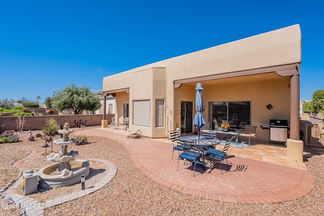 3437 S Abrego Dr, Green Valley, AZ 85614 - rear view of property featuring stucco siding, fence, and a patio area