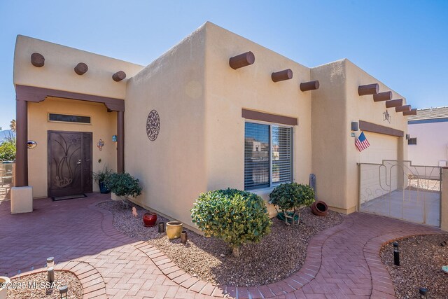 3437 S Abrego Dr, Green Valley, AZ 85614 - exterior space with stucco siding and a garage