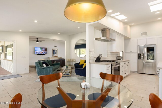 dining room featuring recessed lighting, visible vents, ceiling fan, and plenty of natural light