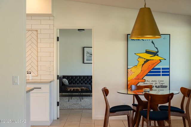 dining area with light tile patterned flooring