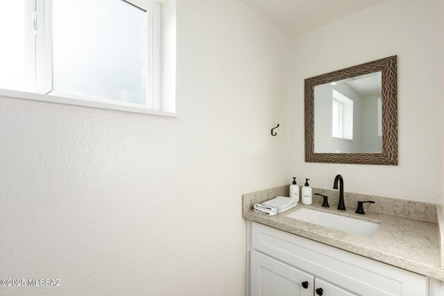 laundry room featuring light tile patterned floors, a sink, baseboards, separate washer and dryer, and a skylight