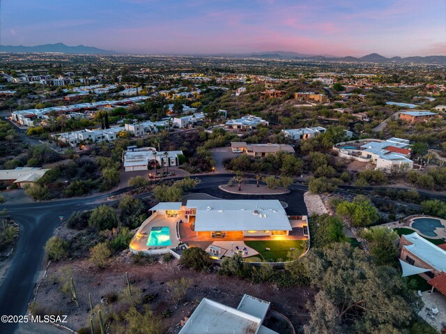 birds eye view of property with a mountain view