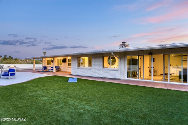 ranch-style house with a mountain view, an attached garage, and brick siding
