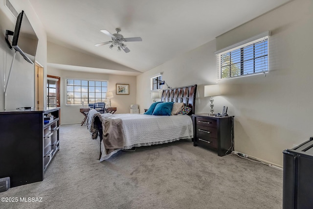 carpeted bedroom with baseboards, multiple windows, ceiling fan, and lofted ceiling