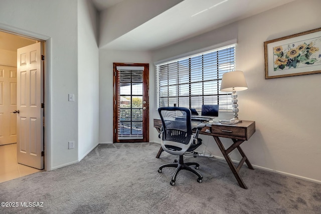 home office featuring carpet floors and a wealth of natural light