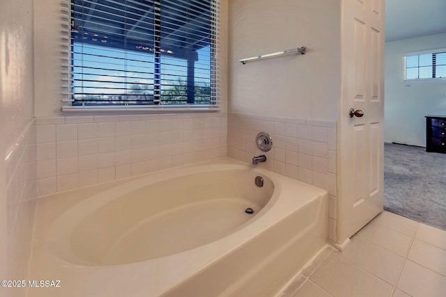 full bath with tile patterned floors and a garden tub