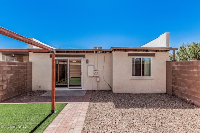 8851 E Elvenstone Way, Tucson, AZ 85730 - back of house with fence, stucco siding, and a patio area