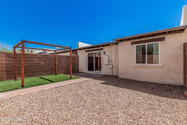 8851 E Elvenstone Way, Tucson, AZ 85730 - back of house featuring fence, stucco siding, and a patio