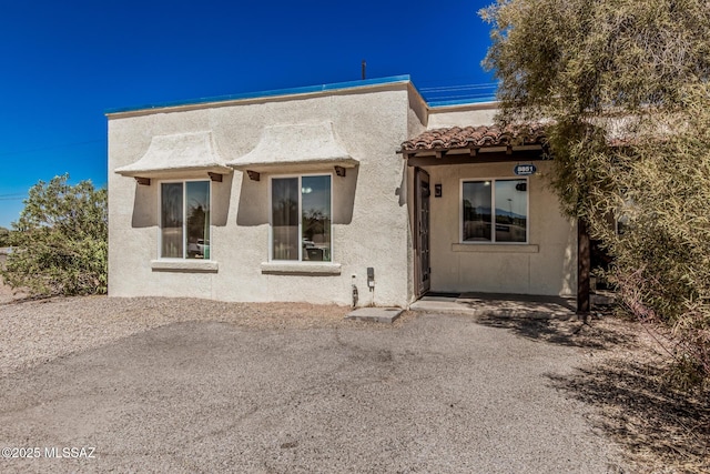 8851 E Elvenstone Way, Tucson, AZ 85730 - rear view of house with stucco siding and a tiled roof
