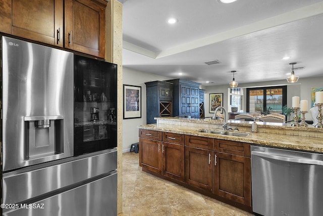 3167 N Corona Pl, Nogales, AZ 85621 - kitchen featuring hanging light fixtures, a sink, light stone counters, and appliances with stainless steel finishes
