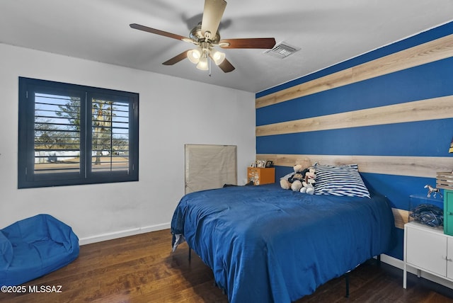 3167 N Corona Pl, Nogales, AZ 85621 - bedroom featuring baseboards, ceiling fan, visible vents, and wood finished floors