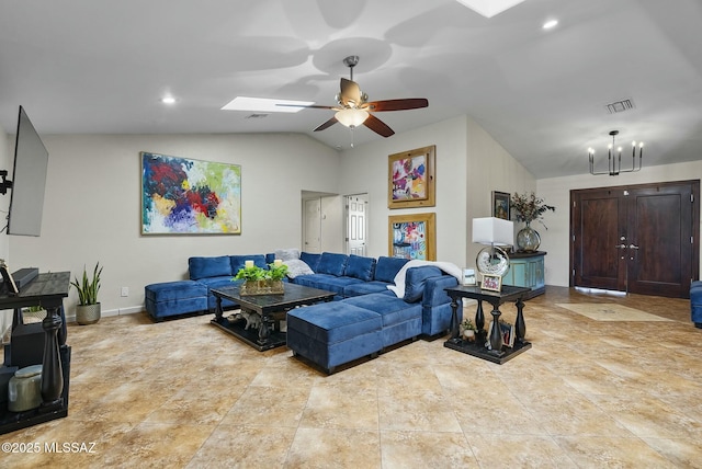 3167 N Corona Pl, Nogales, AZ 85621 - living area with visible vents, baseboards, tile patterned floors, ceiling fan with notable chandelier, and lofted ceiling with skylight