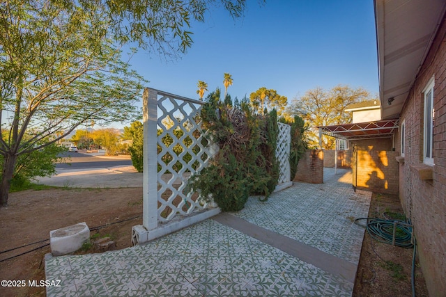 view of patio / terrace with a gate and fence