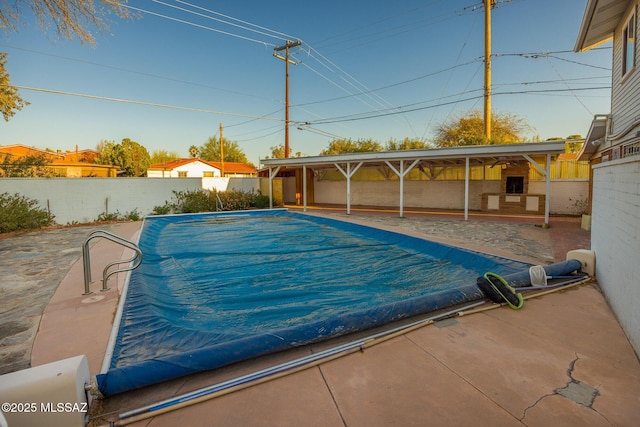 view of swimming pool with a fenced backyard, a fenced in pool, and a patio area