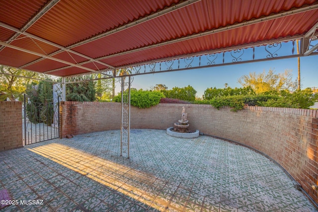 view of patio / terrace with a gate and fence