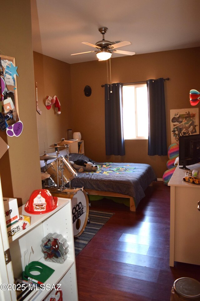 bedroom featuring dark wood-style flooring