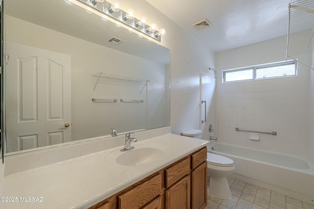 full bathroom featuring visible vents, toilet, vanity, and shower / tub combination
