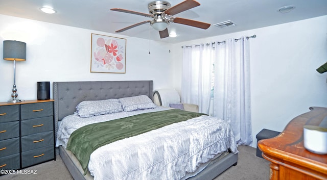 bedroom with carpet, ceiling fan, and visible vents