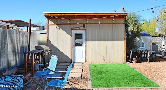 view of shed featuring a fenced backyard