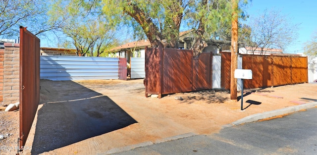 exterior space featuring a gate and fence