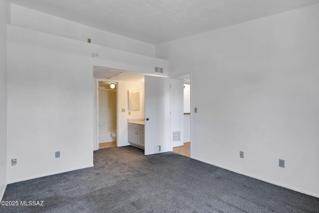 2172 N Pantano Rd Unit 217, Tucson, AZ 85715 - empty room with dark colored carpet and baseboards