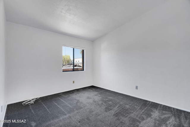 2172 N Pantano Rd Unit 217, Tucson, AZ 85715 - empty room featuring dark colored carpet and baseboards