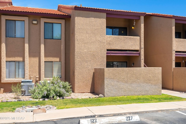 2172 N Pantano Rd Unit 217, Tucson, AZ 85715 - view of property with uncovered parking and central AC unit