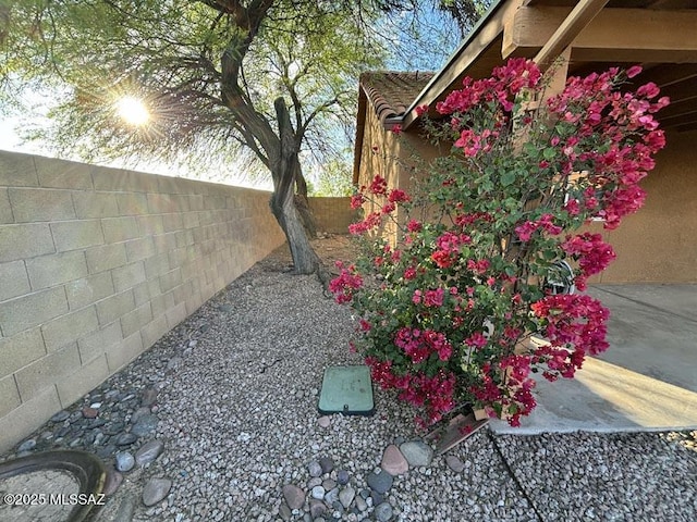 exterior space with a fenced backyard