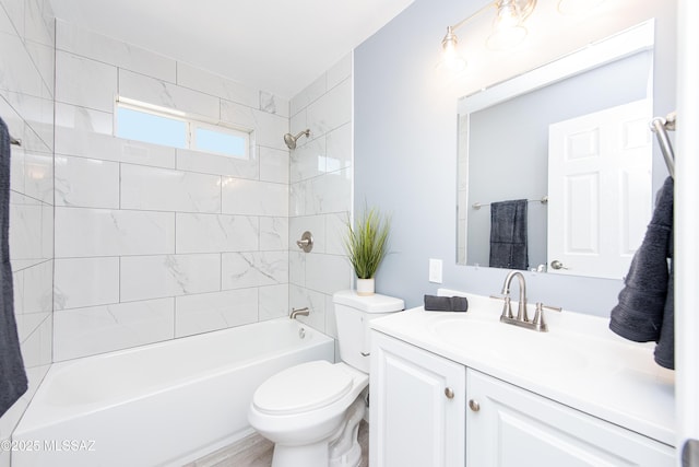 full bathroom featuring shower / bathing tub combination, toilet, and vanity