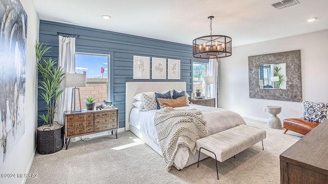 bedroom featuring baseboards, a notable chandelier, visible vents, and carpet