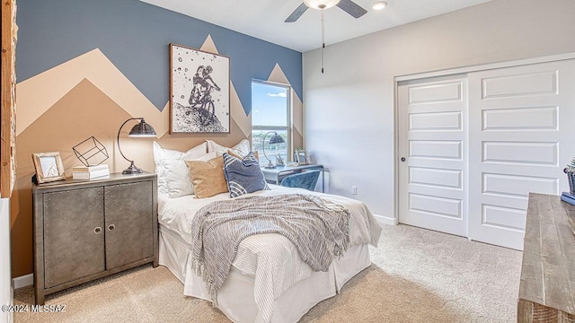 bedroom with baseboards, carpet floors, ceiling fan, and a closet