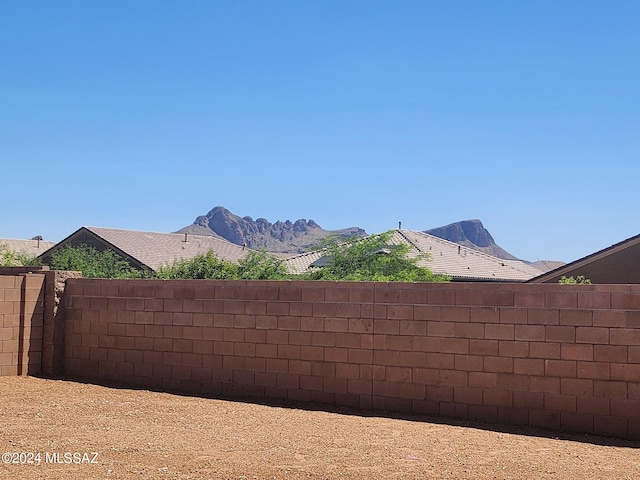 view of yard with a mountain view and a fenced backyard