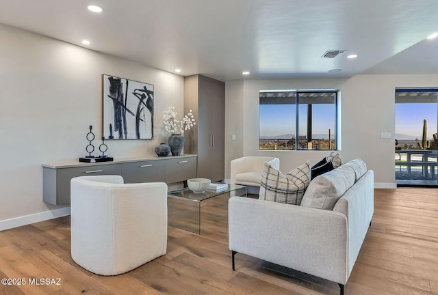 6800 N Cocopas Rd, Tucson, AZ 85718 - living room featuring wood finished floors, baseboards, healthy amount of natural light, and recessed lighting
