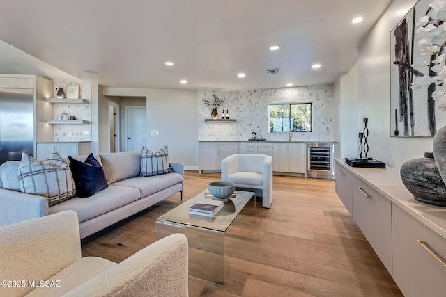 6800 N Cocopas Rd, Tucson, AZ 85718 - living area with wine cooler, recessed lighting, light wood finished floors, and bar area