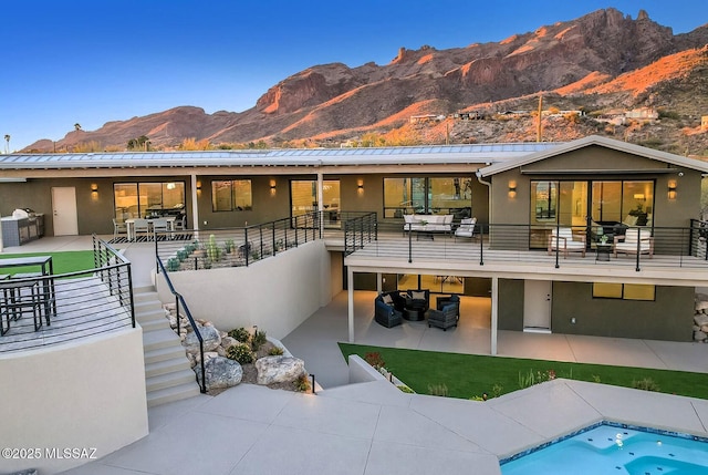 6800 N Cocopas Rd, Tucson, AZ 85718 - rear view of property with stairway, a mountain view, a patio area, an outdoor living space, and a balcony