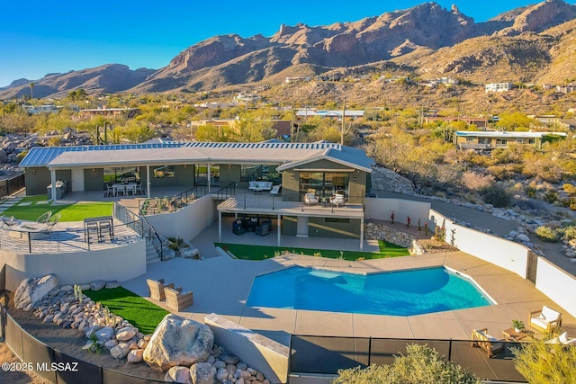6800 N Cocopas Rd, Tucson, AZ 85718 - swimming pool featuring a mountain view, a fenced backyard, and a patio