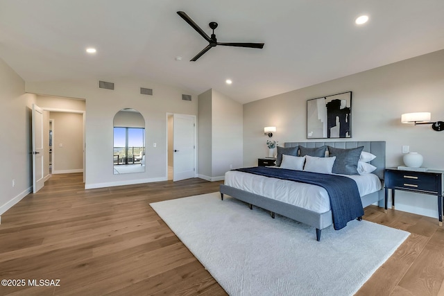 6800 N Cocopas Rd, Tucson, AZ 85718 - bedroom with vaulted ceiling, wood finished floors, recessed lighting, baseboards, and ceiling fan